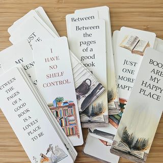 Set of book-themed bookmarks on a wooden surface